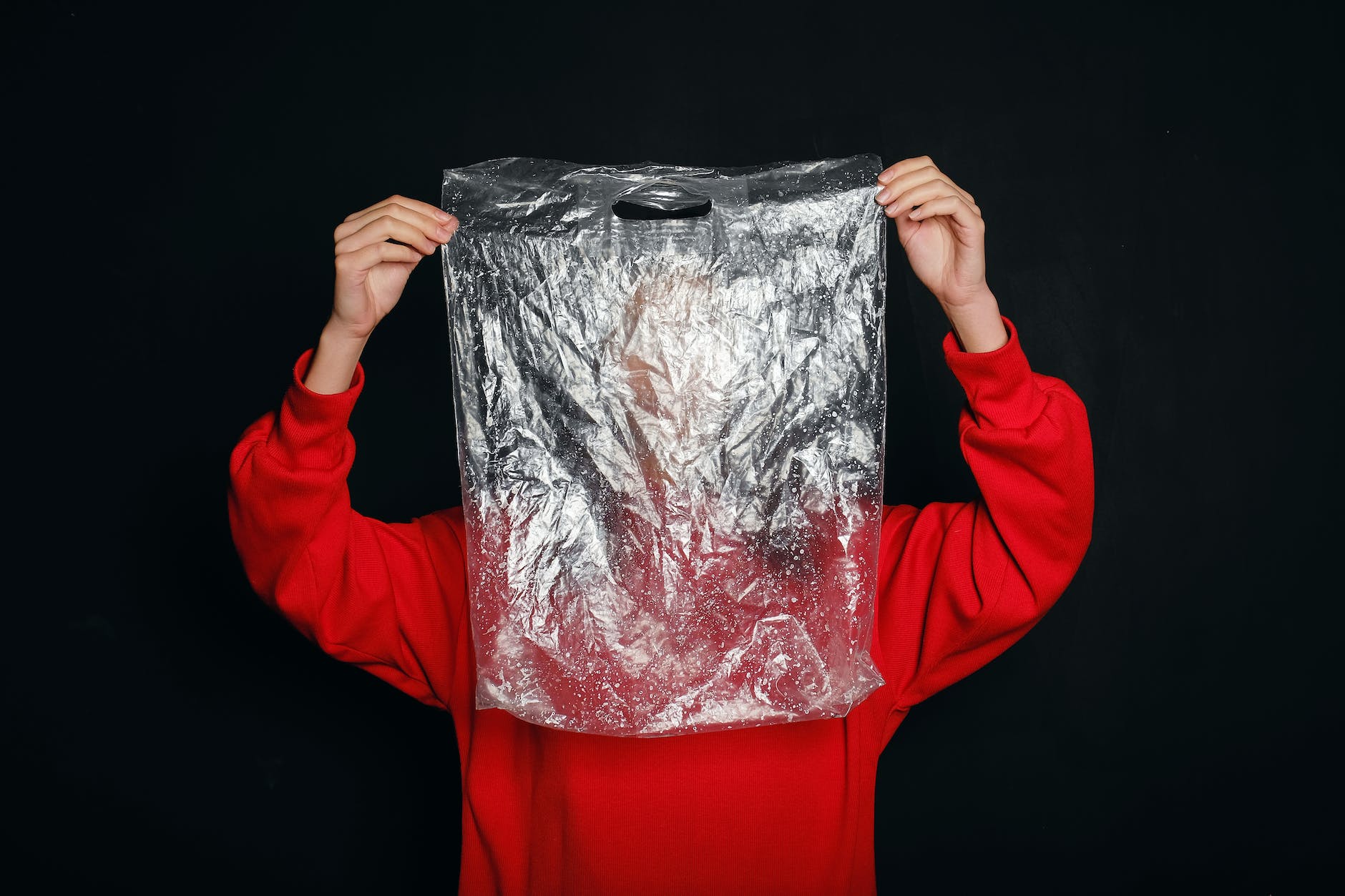 person holding a plastic bag